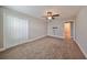 Spacious bedroom with ceiling fan and double-door closet at 14319 Italia Dr, Wimauma, FL 33598