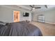 Spacious primary bedroom with large TV and walk-in closet at 14319 Italia Dr, Wimauma, FL 33598