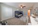 Bedroom with bunk beds, desk, and ceiling fan at 14319 Italia Dr, Wimauma, FL 33598