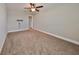 Spacious bedroom with ceiling fan and neutral walls at 14319 Italia Dr, Wimauma, FL 33598