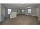 Bright and airy bonus room featuring carpet and neutral decor at 14319 Italia Dr, Wimauma, FL 33598