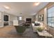Large bonus room with carpeted floors and plenty of space for relaxing at 14319 Italia Dr, Wimauma, FL 33598