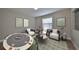 Game room with a poker table, stylish seating, and artwork at 14319 Italia Dr, Wimauma, FL 33598