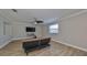 Bright Gathering room with wood-look floors and a large TV at 14319 Italia Dr, Wimauma, FL 33598