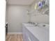 Laundry room with washer, dryer, and shelving at 14319 Italia Dr, Wimauma, FL 33598