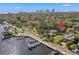 Aerial view of waterfront home with private dock, city skyline in background at 2311 Brevard Ne Rd, St Petersburg, FL 33704