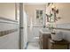 Clean bathroom with white tile and updated vanity at 2311 Brevard Ne Rd, St Petersburg, FL 33704