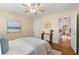 Comfortable bedroom with hardwood floors and access to another room at 2311 Brevard Ne Rd, St Petersburg, FL 33704