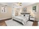 Serene bedroom featuring hardwood floors and ample natural light at 2311 Brevard Ne Rd, St Petersburg, FL 33704