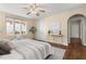 Bright bedroom with hardwood floors, and a view of the backyard at 2311 Brevard Ne Rd, St Petersburg, FL 33704