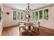 Bright dining room featuring hardwood floors and large windows at 2311 Brevard Ne Rd, St Petersburg, FL 33704