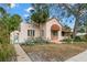 Front view of charming Spanish style home with gated entry at 2311 Brevard Ne Rd, St Petersburg, FL 33704