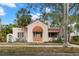 Spanish style home with mature trees and a terracotta roof at 2311 Brevard Ne Rd, St Petersburg, FL 33704