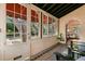 Inviting front porch with tiled floor and ample natural light at 2311 Brevard Ne Rd, St Petersburg, FL 33704