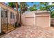 Two-car garage with brick paved driveway at 2311 Brevard Ne Rd, St Petersburg, FL 33704