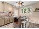 Eat-in kitchen with granite island and white cabinetry at 2311 Brevard Ne Rd, St Petersburg, FL 33704