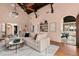 Living room with high ceilings, hardwood floors, and access to patio at 2311 Brevard Ne Rd, St Petersburg, FL 33704