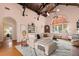 Spacious living room with high ceilings, fireplace, and hardwood floors at 2311 Brevard Ne Rd, St Petersburg, FL 33704