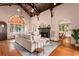 High-ceilinged living room with fireplace and hardwood floors at 2311 Brevard Ne Rd, St Petersburg, FL 33704