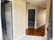 Bright and airy entryway with hardwood floors and access to other rooms at 6554 Gentle Ben Cir, Wesley Chapel, FL 33544
