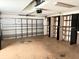 Garage with built-in shelving and overhead storage at 6554 Gentle Ben Cir, Wesley Chapel, FL 33544