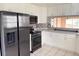 Kitchen boasts stainless steel appliances and ample cabinet space at 6554 Gentle Ben Cir, Wesley Chapel, FL 33544