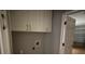 Laundry room with upper cabinets and washer/dryer hookups at 6554 Gentle Ben Cir, Wesley Chapel, FL 33544