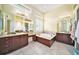 Spa-like Primary bathroom with soaking tub and double vanity at 8478 Dunham Station Dr, Tampa, FL 33647