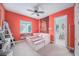 Coral bedroom with a daybed and access to a full bathroom at 8478 Dunham Station Dr, Tampa, FL 33647