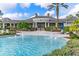 Elegant community clubhouse with fountain and patio area at 8478 Dunham Station Dr, Tampa, FL 33647