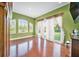 Spacious Gathering room with hardwood floors and backyard access at 8478 Dunham Station Dr, Tampa, FL 33647