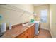 Laundry room with built-in cabinets and sink at 8478 Dunham Station Dr, Tampa, FL 33647