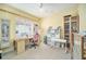 Home office with built-in shelving and ample workspace at 8478 Dunham Station Dr, Tampa, FL 33647