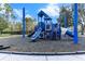Community playground with a blue play structure, slides, and climbing features at 8478 Dunham Station Dr, Tampa, FL 33647