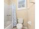 Small bathroom with shower/tub combo and patterned curtain at 18214 Stillwell Ln, Tampa, FL 33647