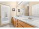 Double vanity bathroom with large mirror and natural light at 18214 Stillwell Ln, Tampa, FL 33647