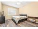 Bedroom with a queen bed, TV, and window with shutters at 18214 Stillwell Ln, Tampa, FL 33647