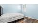 Light and airy bedroom with wood-look floors at 18214 Stillwell Ln, Tampa, FL 33647