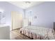 Bedroom with double closet and floral bedspread at 18214 Stillwell Ln, Tampa, FL 33647