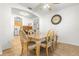 Dining area with light wood table and chairs, adjacent to kitchen at 18214 Stillwell Ln, Tampa, FL 33647