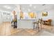 Kitchen with light wood cabinets, breakfast bar, and dining area at 18214 Stillwell Ln, Tampa, FL 33647