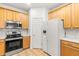 Modern kitchen with stainless steel appliances and white countertops at 18214 Stillwell Ln, Tampa, FL 33647