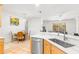 Kitchen with island, stainless steel appliances, and dining area at 18214 Stillwell Ln, Tampa, FL 33647