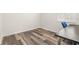 Home office with wood-look flooring and built-in desk at 18214 Stillwell Ln, Tampa, FL 33647