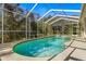 Enjoy this refreshing screened pool area at 18214 Stillwell Ln, Tampa, FL 33647