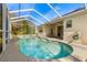 Inviting screened pool with ample patio space at 18214 Stillwell Ln, Tampa, FL 33647
