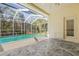 Relaxing pool area with screened enclosure at 18214 Stillwell Ln, Tampa, FL 33647