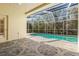 Relaxing pool and patio area with screened enclosure at 18214 Stillwell Ln, Tampa, FL 33647