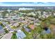 Aerial view of residential neighborhood with lake at 22247 Red Jacket Ln, Land O Lakes, FL 34639