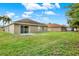 Spacious backyard with a large grassy area at 22247 Red Jacket Ln, Land O Lakes, FL 34639